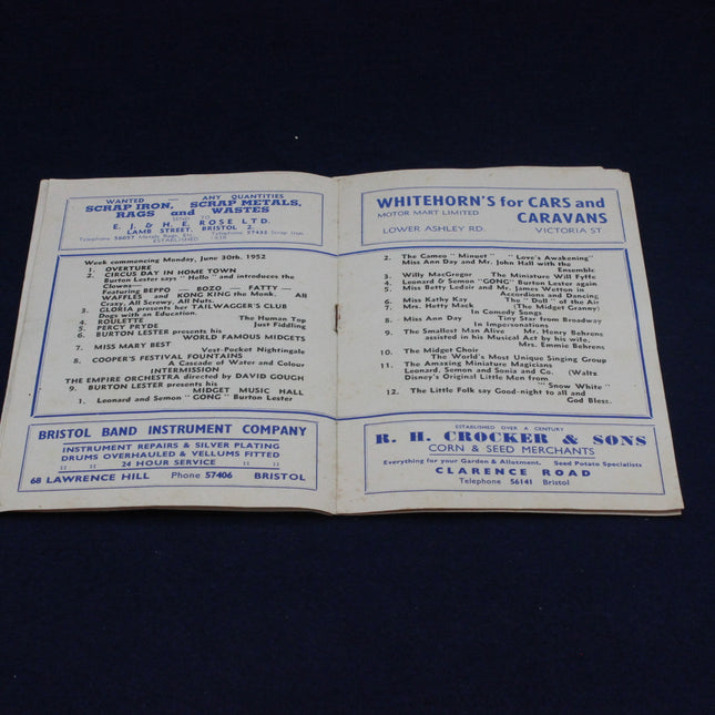 Open New Empire Bristol Programme Flyer with printed text on a dark background