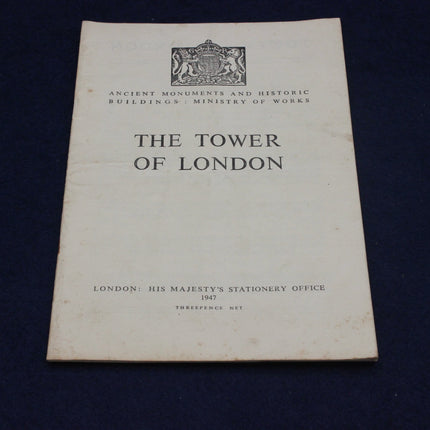 Booklet titled 'The Tower of London' with a logo on a dark background