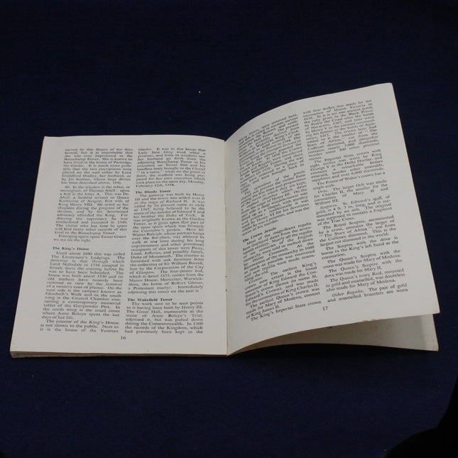 Open 1947 Ministry of Works Tower of London Booklet with text on a dark background