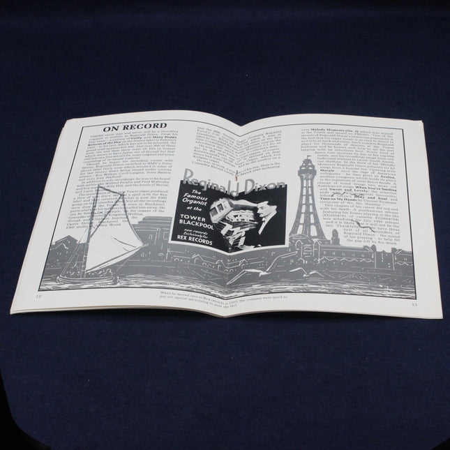 Open Reginald Dixon MBE Souvenir Booklet with black and white illustrations and text on a dark background