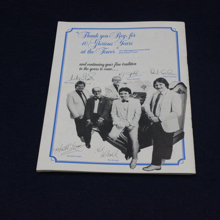 Memorabilia Reginald Dixon MBE Souvenir Booklet with a black and white photo of five men and signatures, on a dark background.