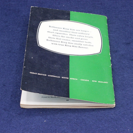 Rothmans Test Cricket Almanackt with black and green cover on a blue background