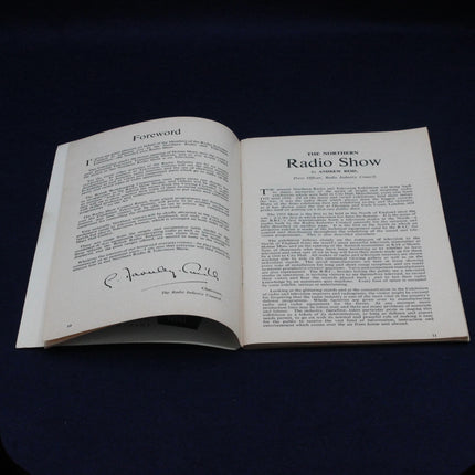 Open 1952 Northern Radio Show Catalogue with text on a dark background