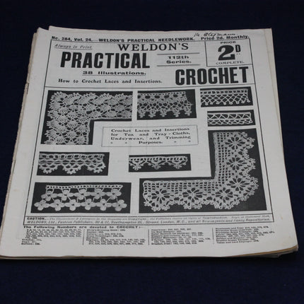 Vintage book cover of 'Weldon's Practical Needlework' with lace patterns and text.