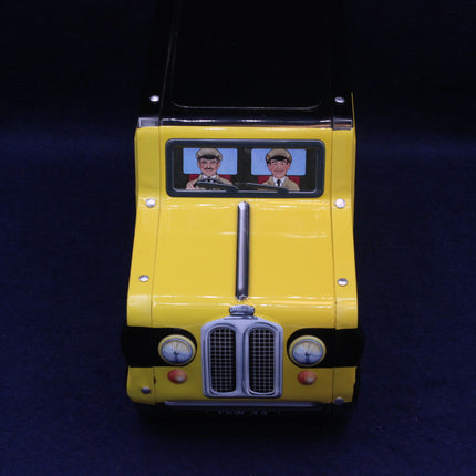 Yellow toy truck with a dark background