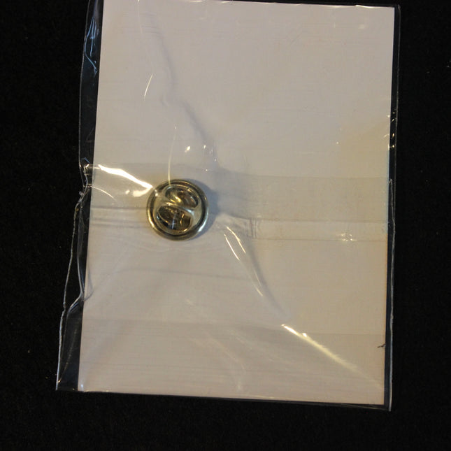 Metallic pin on a white card with clear plastic wrap, black background