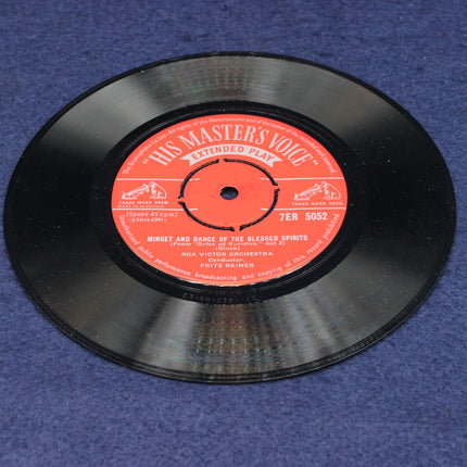 Vinyl record with red label on a blue textured background