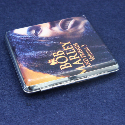 Compact mirror with Bob Marley and Friends design on a blue background
