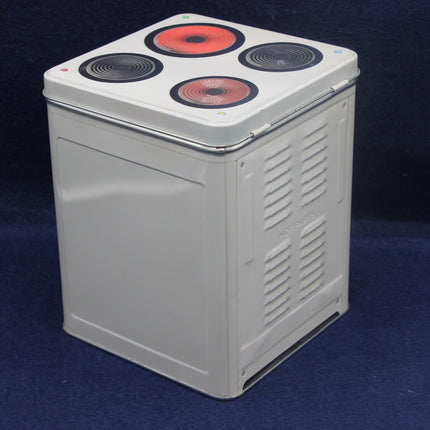 Rectangular electronic device with red and black circular components on a dark blue background