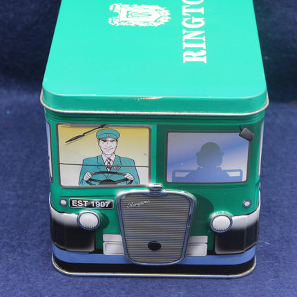 Green tin box designed like a vintage bus with a driver illustration on a blue background