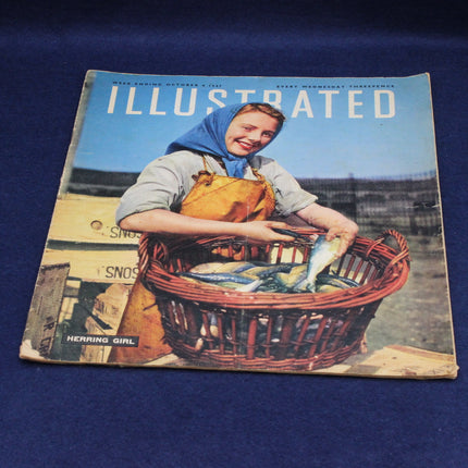 Vintage Illustrated magazine cover with a woman holding a basket of fish on a blue background