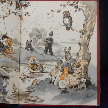 Illustrated book open to a page with animal characters by a pond.