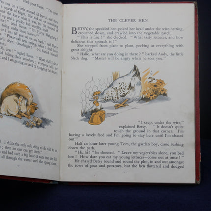 Open book with illustrations and text of a hen and fox, on a dark background