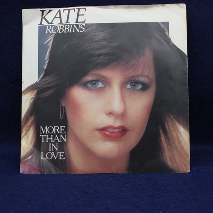 Album cover with a portrait of a woman and text 'Kate Robbins More Than In Love' on a blue background
