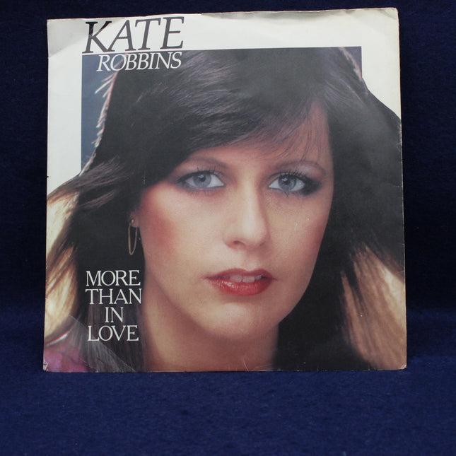 Album cover with a portrait of a woman and text 'Kate Robbins More Than In Love' on a blue background