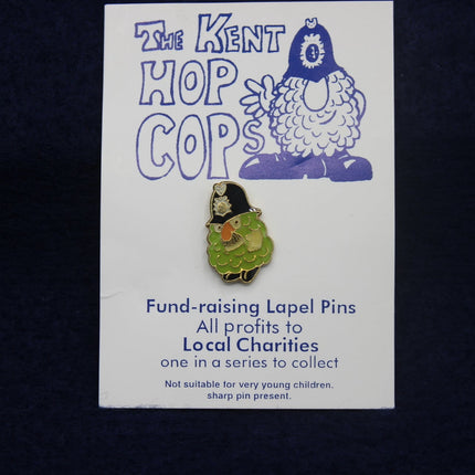 Kent Hop Cops fund-raising lapel pin on a card with a dark background