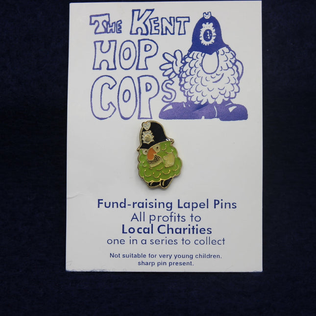 Kent Hop Cops fund-raising lapel pin on a card with a dark background