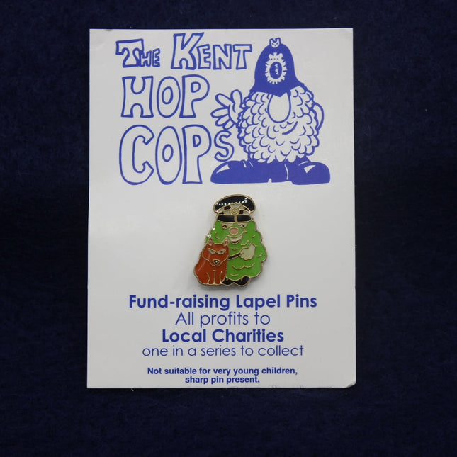 Kent Hop Cops lapel pin on a card with text about local charities