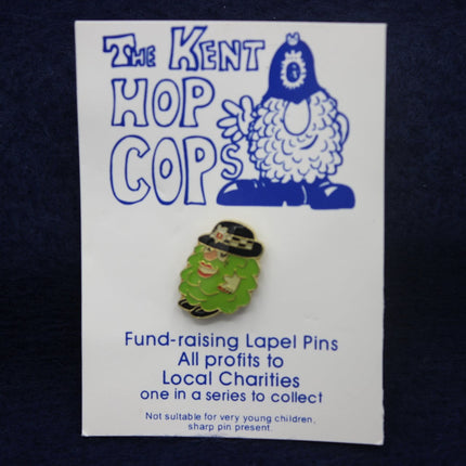 Kent Hop Cops fund-raising lapel pin on a card with a dark background