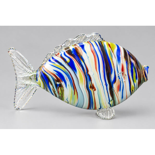 A hand-blown glass fish sculpture with a marbled pattern of blue, green, yellow, brown, and white swirls on a clear glass base, set against a bright green background.