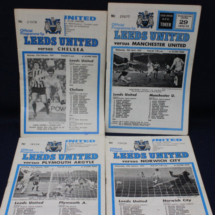 Four Leeds United football match programs from different matches against Manchester United, Plymouth Argyle, and Norwich City.
