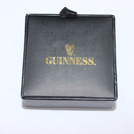 Black box with gold 'Guinness' logo on a white background