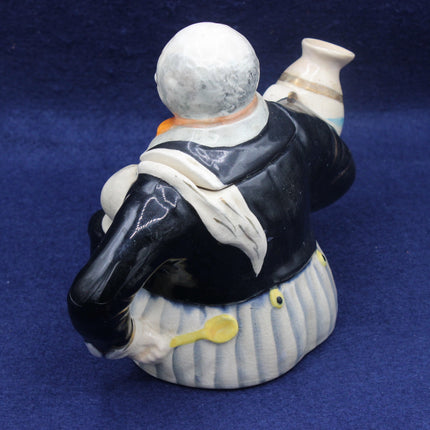 Oliver Twist Teapot on a dark blue background