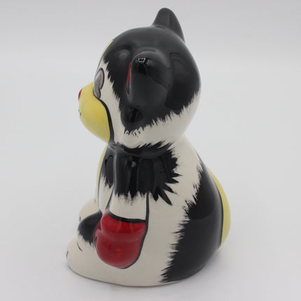 A glossy ceramic ali cat ornament