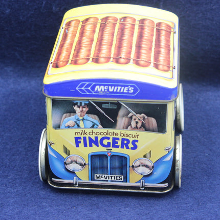 McVitie's Fingers milk chocolate biscuit tin shaped like a vintage van on a blue background