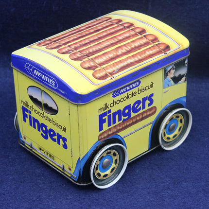 Toy truck-shaped container for McVitie's milk chocolate biscuit Fingers on a blue background