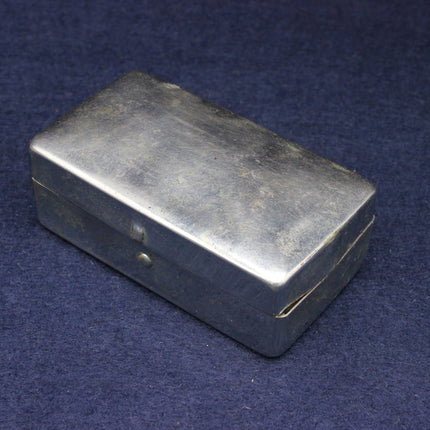 Rectangular metal box on a blue background