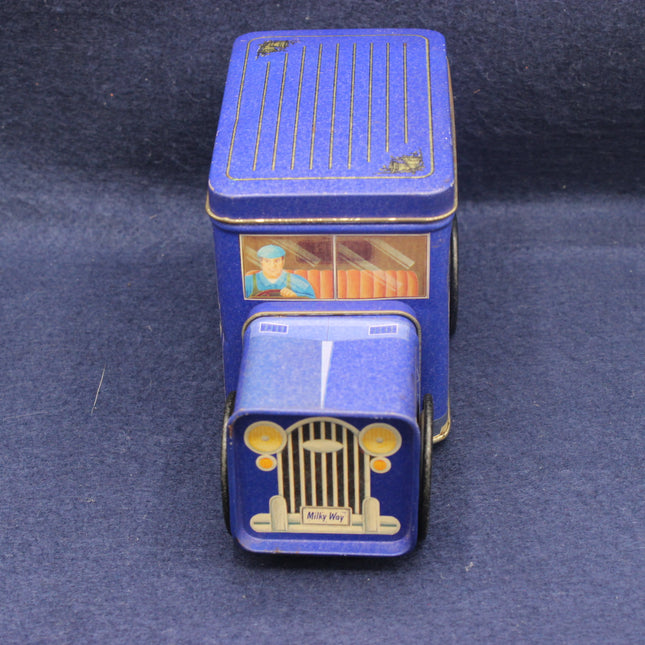 Blue vintage-style toy truck on a dark blue background