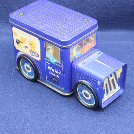 Blue Milky Way candy truck-shaped tin on a blue background