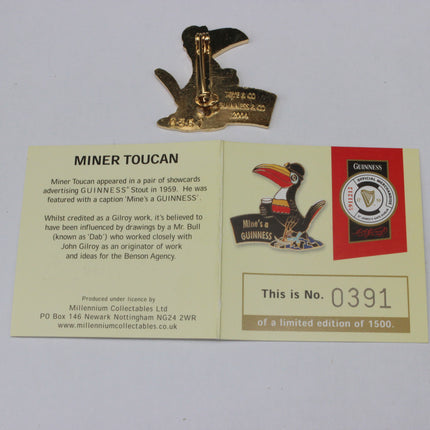 Gold Miner Toucan pin with a display card featuring Guinness branding and information.