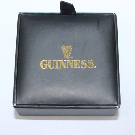 Black box with gold 'Guinness' logo on a white background