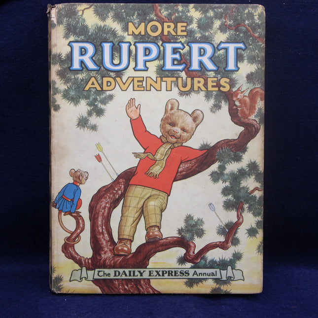 Book cover of 'More Rupert Adventures' with a bear character on a tree branch against a blue background