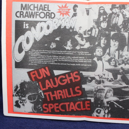 Vintage movie poster for 'Condomman' with black and white images and red text.