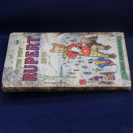 Vintage 'The New Rupert Book' on a blue background