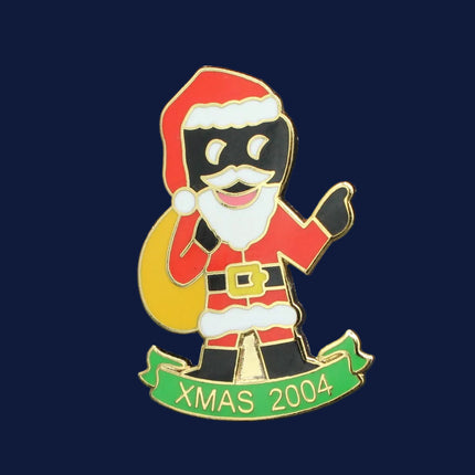 Pin with cartoon character in Santa Claus outfit on a blue background