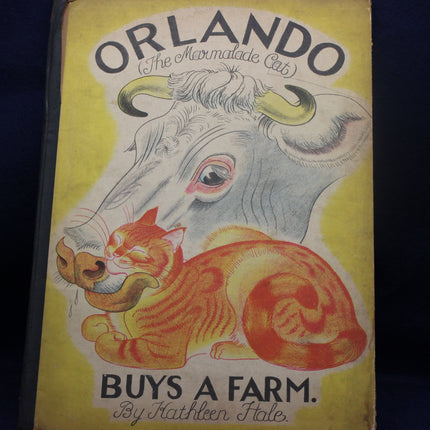 Book cover of 'Orlando the Marmalade Cat Buys a Farm' with a cat and cow illustration on a yellow background.
