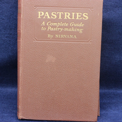 Book titled 'Pastries: A Complete Guide to Pastry-making' by Nirvana on a blue background