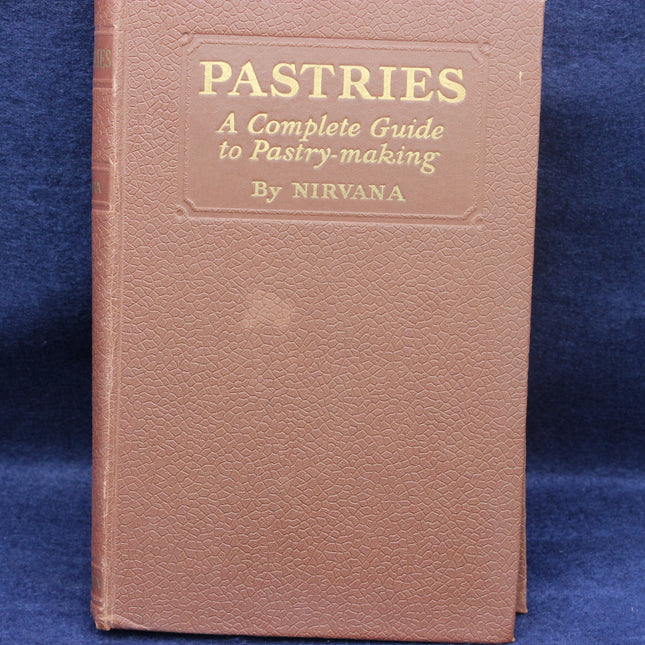 Book titled 'Pastries: A Complete Guide to Pastry-making' by Nirvana on a blue background