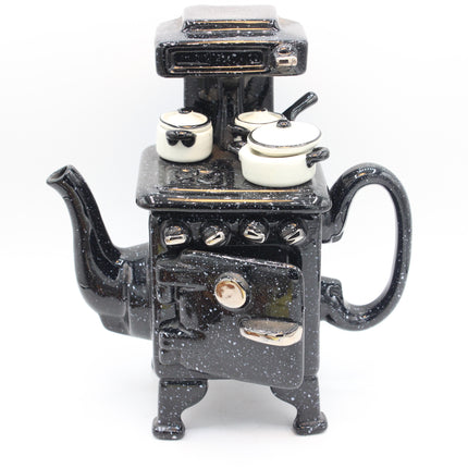 Paul Cardew Design Large Country Kitchen Stove Teapot with black speckled enamel stove-shaped teapot with cream-colored pots on top, photographed against a plain white background.