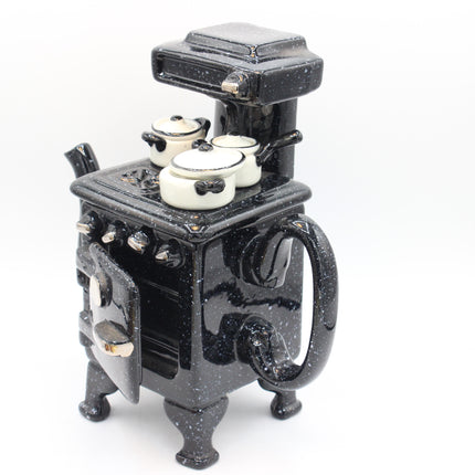 Paul Cardew Design Large Country Kitchen Stove Teapot with white enamel pots on top, photographed on a plain white background.