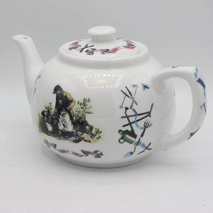 A white ceramic teapot decorated with hand-painted illustrations, including a historical scene on the side and nautical elements, set against a plain light gray background.