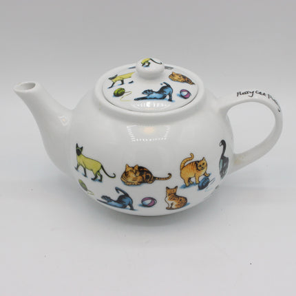 A white ceramic teapot decorated with colorful illustrations of various cats in different poses, shown on a plain light gray background.