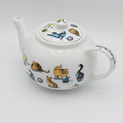 A white ceramic teapot decorated with colorful illustrations of cats and a black swan, featuring the text 'Jury Cat Crazy' on the handle, set against a plain white background.