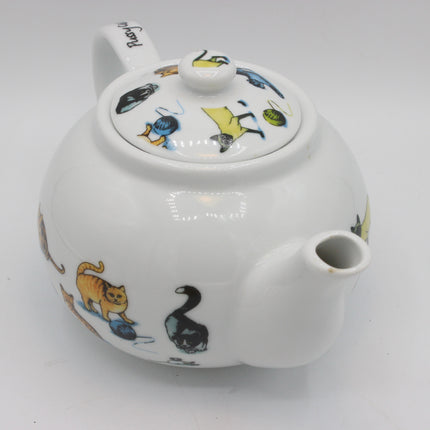 A white ceramic teapot decorated with colorful illustrations of animals, including a black swan, an orange tabby cat, and fish on the lid and body, set against a plain white background.