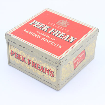 Vintage Peek Frean's biscuit box with a red top panel and cream-colored sides, photographed on a white background.