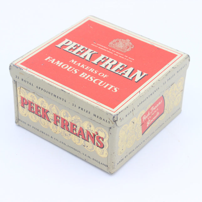 Vintage Peek Frean's biscuit box with a red top panel and cream-colored sides, photographed on a white background.